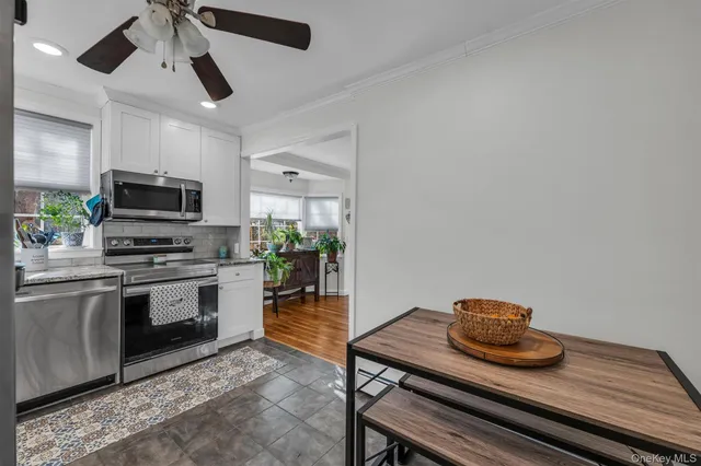 a kitchen with a stove and a microwave