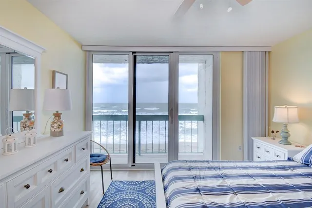 a spacious bedroom with a large bed and a window