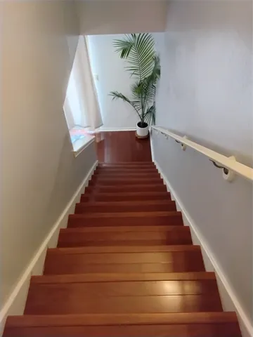 a bedroom with a bed and cabinets