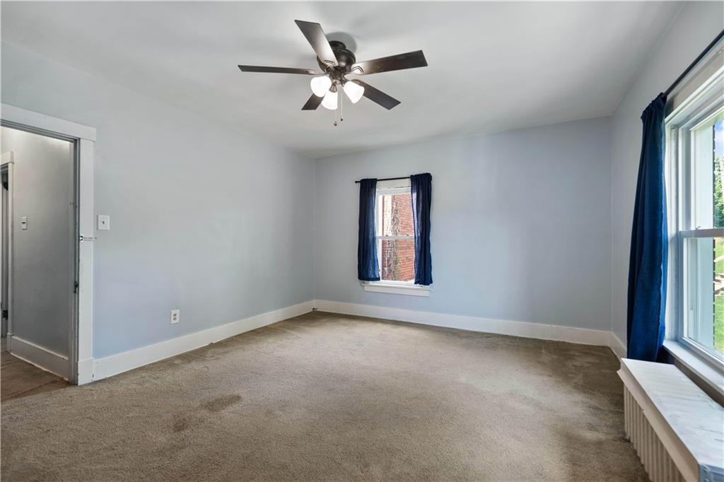 1436 Davis Avenue Pittsburgh, PA 15212 - Photo 18 of 29 an empty room with windows and fan