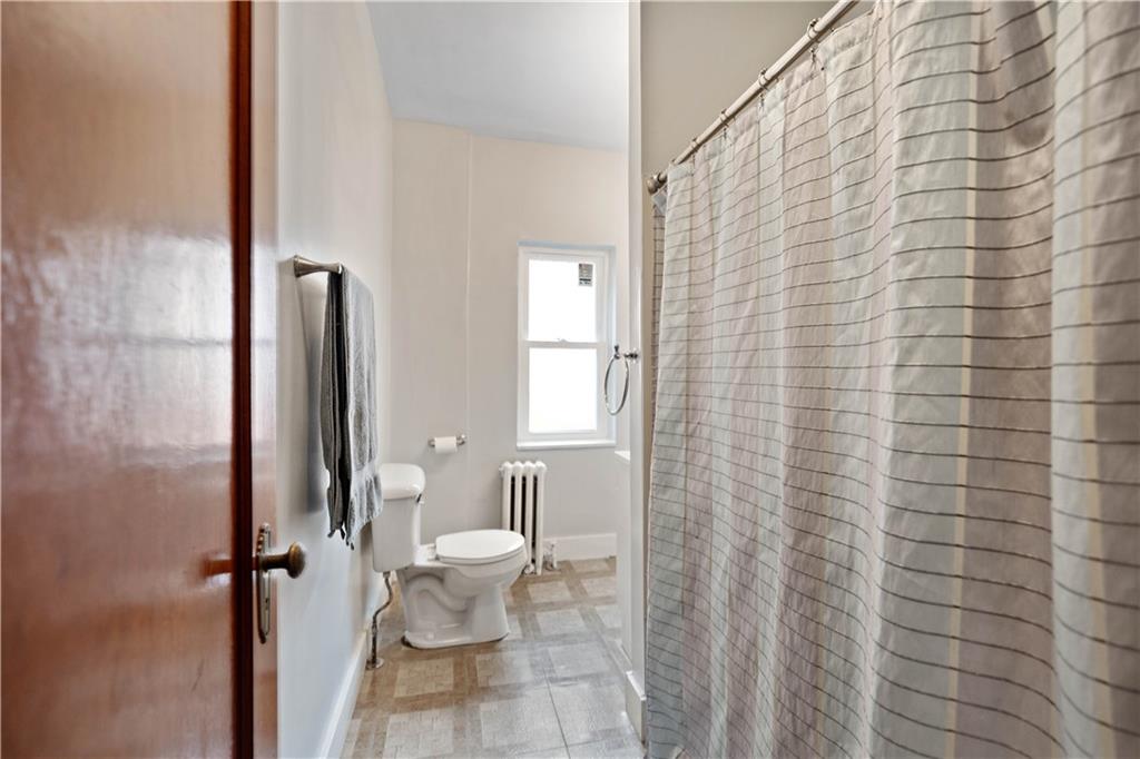 1436 Davis Avenue Pittsburgh, PA 15212 - Photo 19 of 29 a bathroom with a toilet and a shower