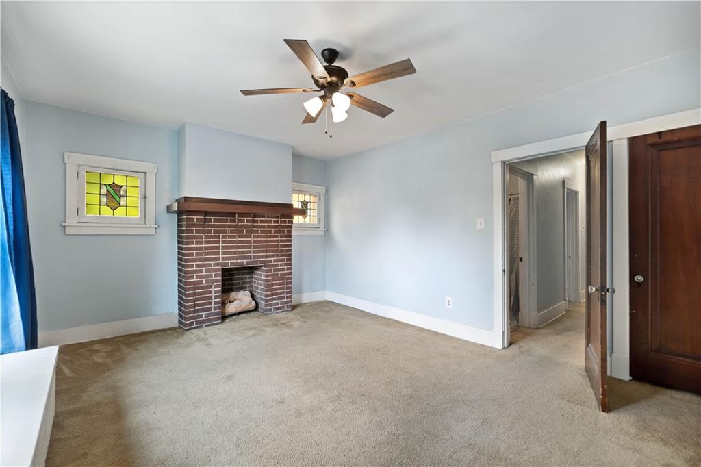 1436 Davis Avenue Pittsburgh, PA 15212 - Photo 23 of 29 a view of an empty room with a ceiling fan and a window