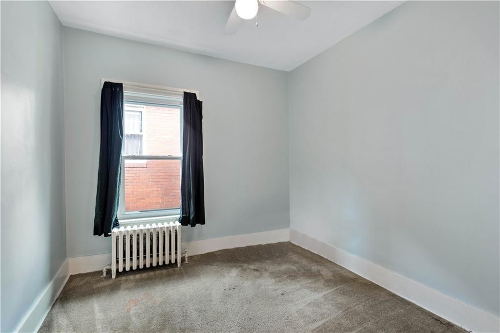 1436 Davis Avenue Pittsburgh, PA 15212 - Photo 24 of 29 an empty room with a window