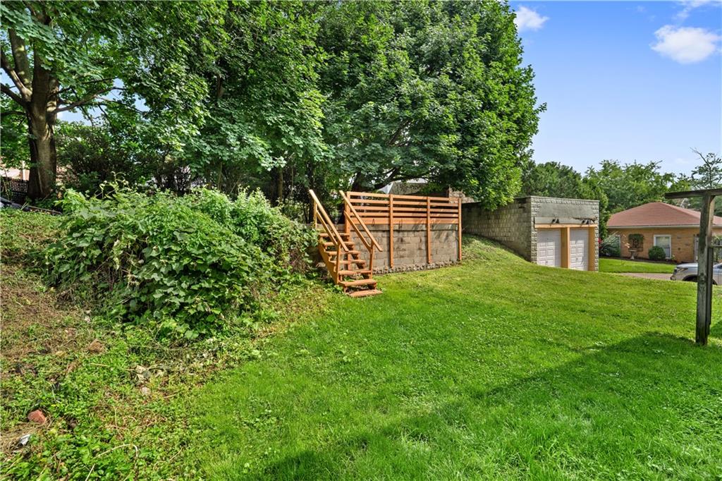 1436 Davis Avenue Pittsburgh, PA 15212 - Photo 26 of 29 a backyard of a house with table and chairs