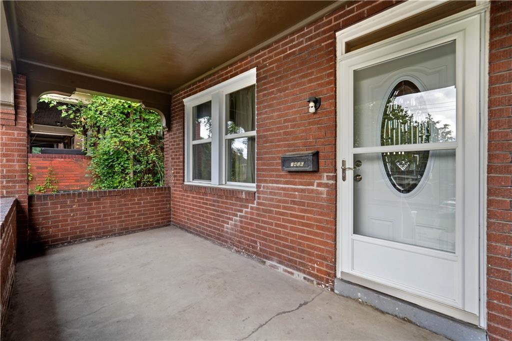 1436 Davis Avenue Pittsburgh, PA 15212 - Photo 3 of 29 a front view of a house with a porch