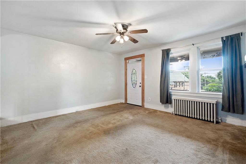 1436 Davis Avenue Pittsburgh, PA 15212 - Photo 6 of 29 an empty room with windows and fan