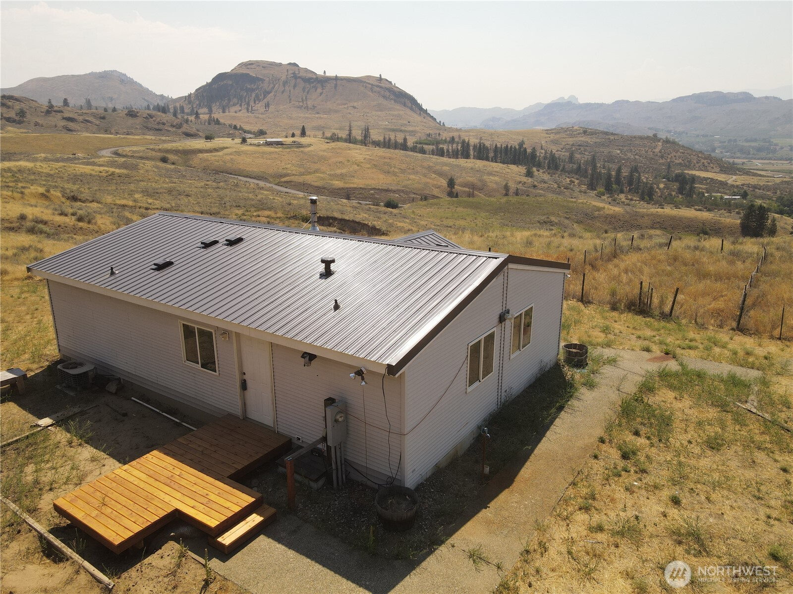 105 Swanson Mill Road Oroville, WA 98844 - Photo 2 of 37 a view of a terrace with a lake
