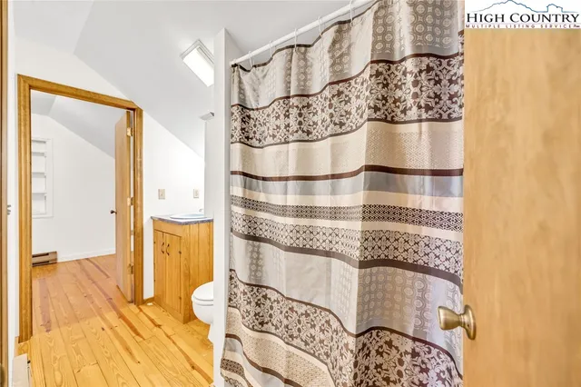 a bathroom with a bathtub and shower