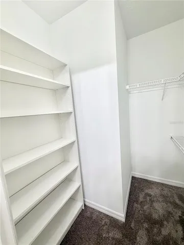 a view of bedroom and empty room