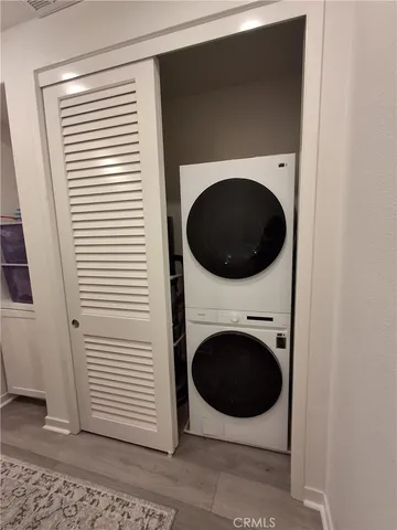 a view of a hallway with washer and dryer