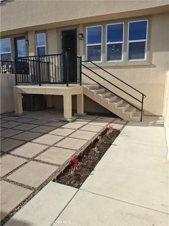 a view of a deck with wooden floor and fence