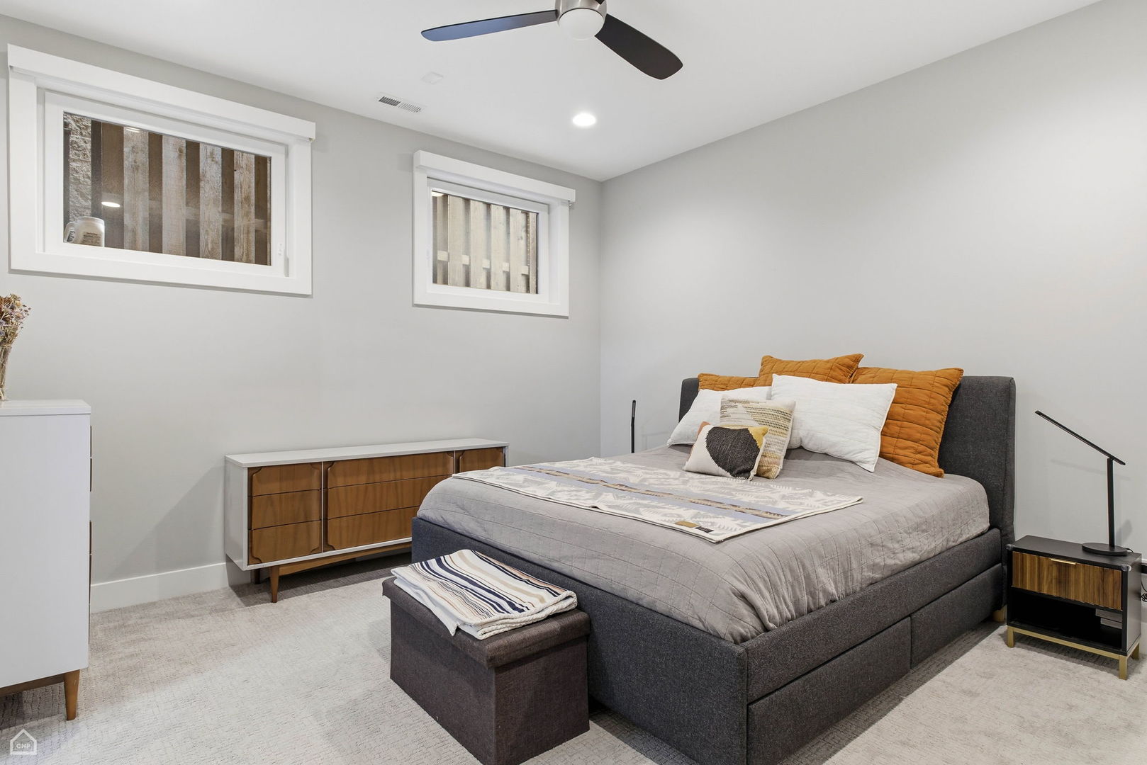 Undisclosed Address Chicago, IL 60625 - Photo 14 of 25 a bedroom with a bed and a chandelier