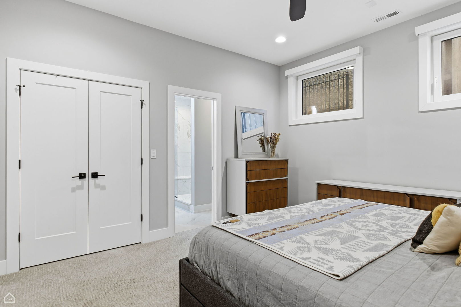 Undisclosed Address Chicago, IL 60625 - Photo 15 of 25 a bedroom with a bed and a chandelier