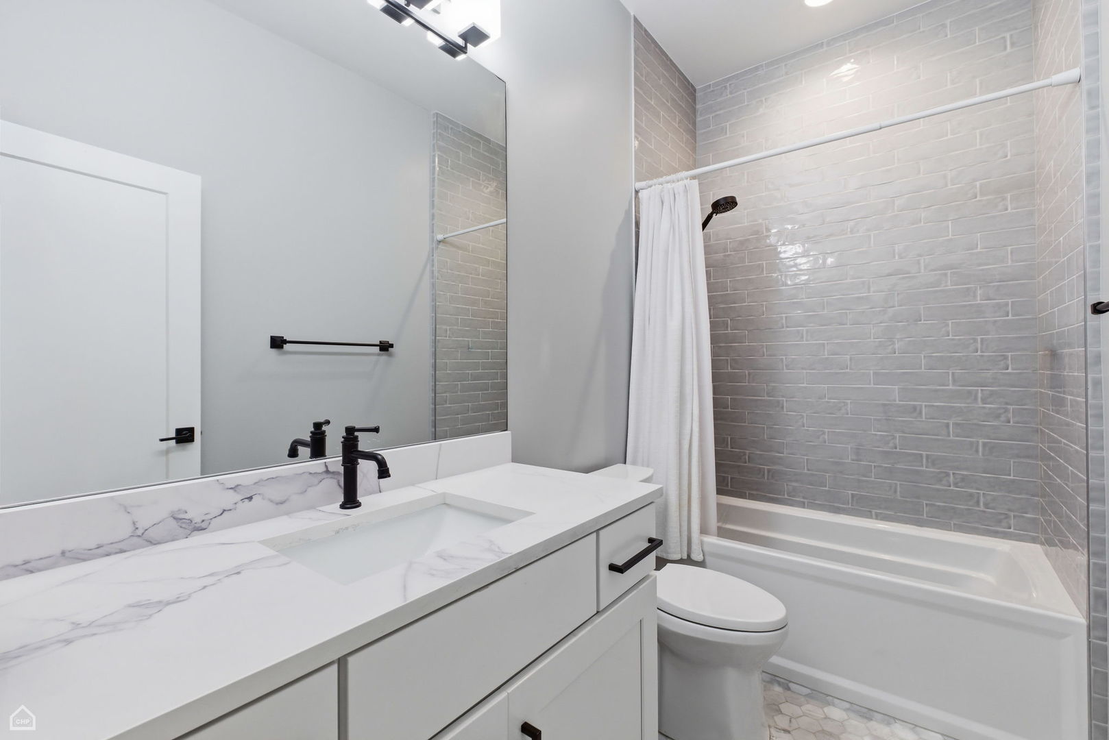 Undisclosed Address Chicago, IL 60625 - Photo 20 of 25 a bathroom with a sink toilet and shower