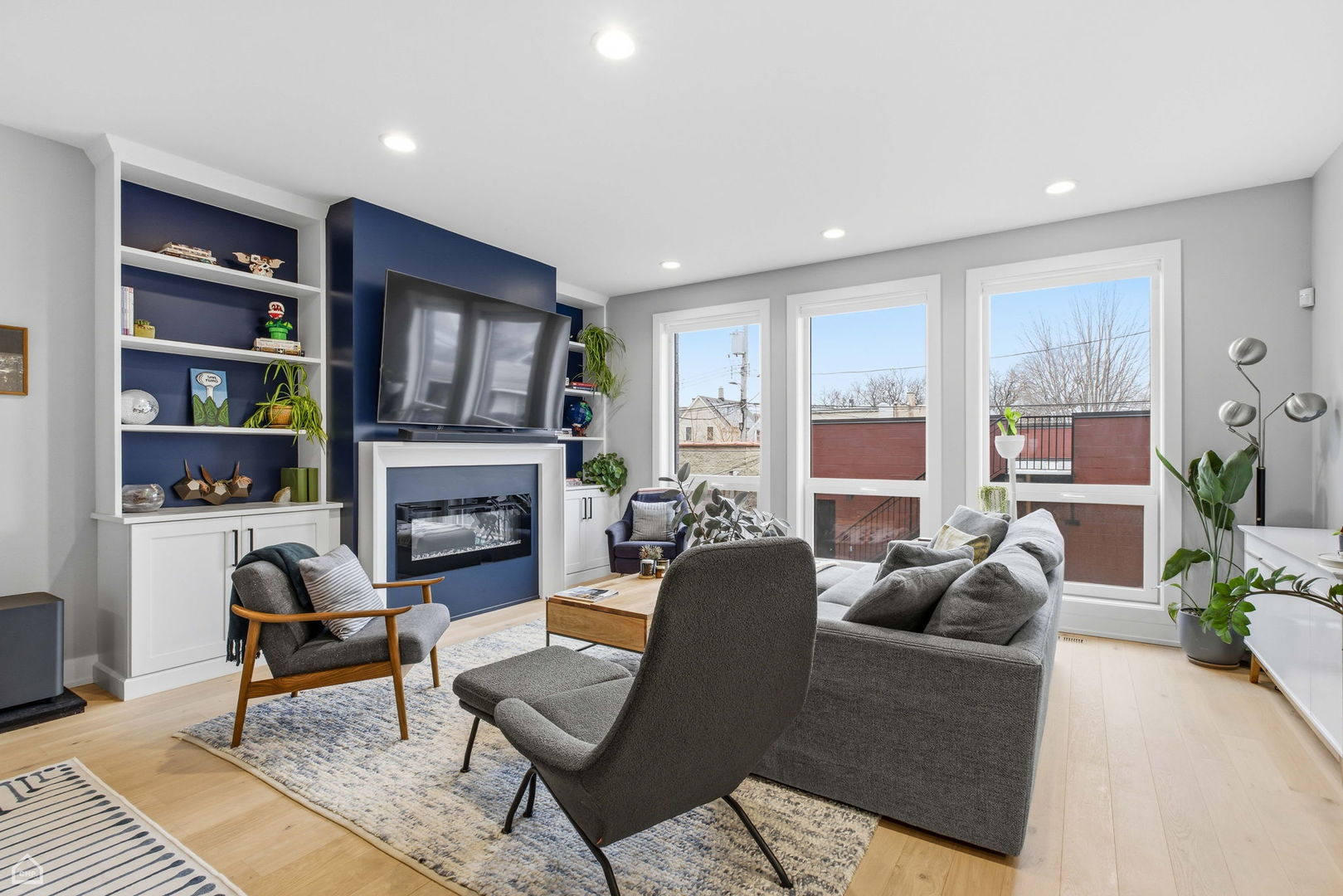 Undisclosed Address Chicago, IL 60625 - Photo 2 of 25 a living room with furniture fireplace and a window