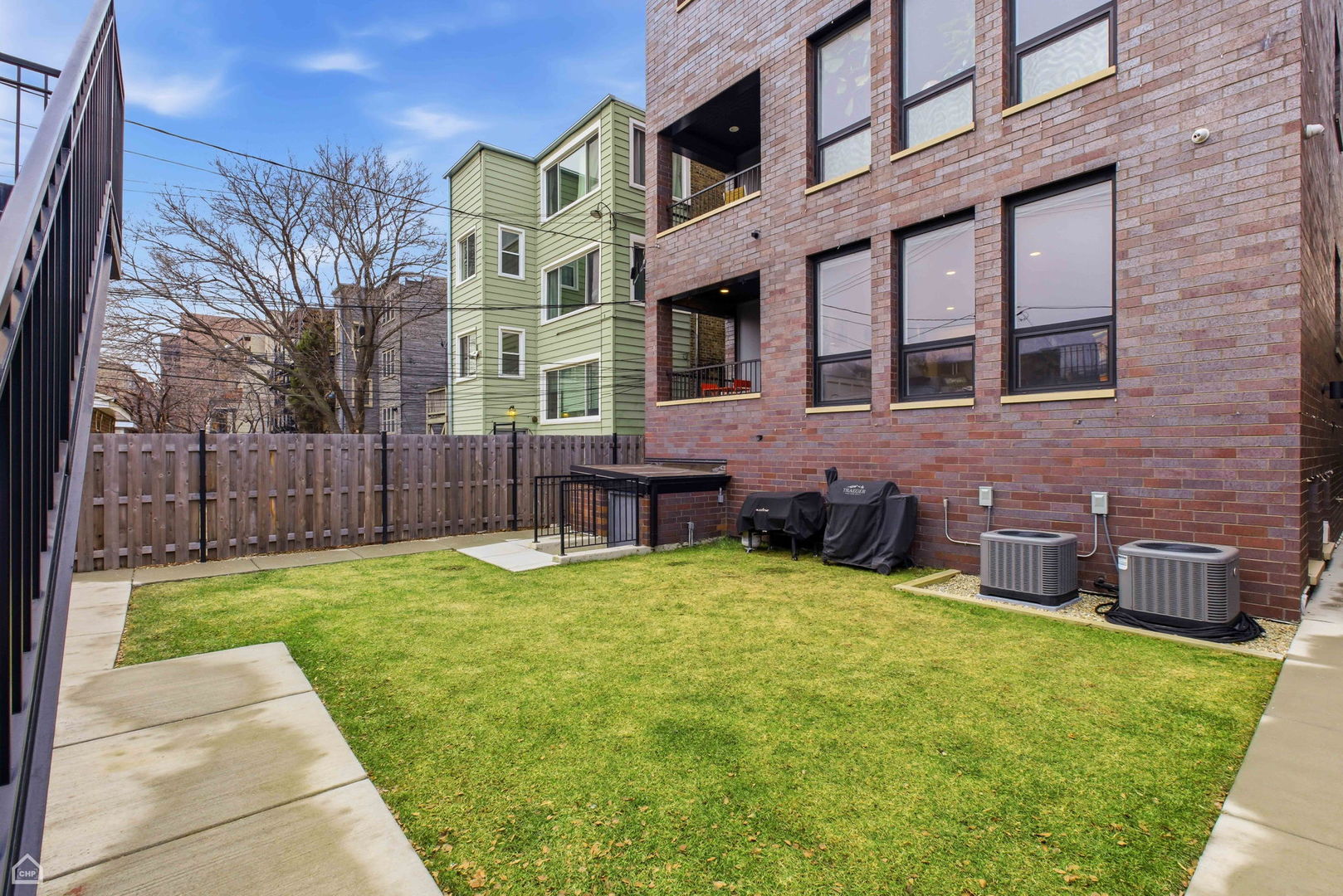 Undisclosed Address Chicago, IL 60625 - Photo 22 of 25 a view of an house with backyard and wooden fence