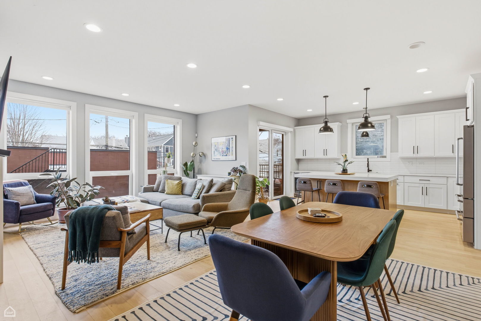 Undisclosed Address Chicago, IL 60625 - Photo 4 of 25 a living room with lots of furniture and view of kitchen