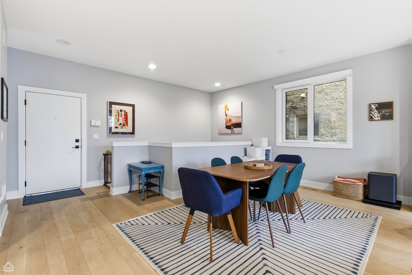 Undisclosed Address Chicago, IL 60625 - Photo 6 of 25 a view of a dining room with furniture and wooden floor