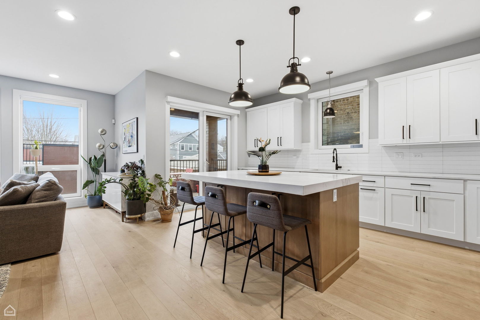 Undisclosed Address Chicago, IL 60625 - Photo 7 of 25 a kitchen with a table chairs refrigerator and cabinets