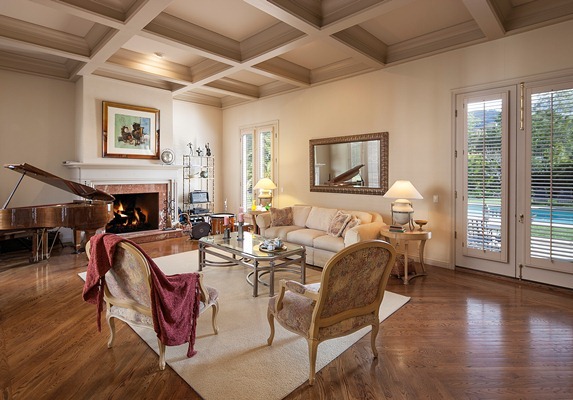 669 Cold Spring Road Montecito, CA 93108 - Photo 8 of 14 a living room with fireplace furniture and a wooden floor
