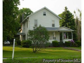 77 State Street Nicholson, PA 18446 - Photo 1 of 1 a front view of a house with a garden