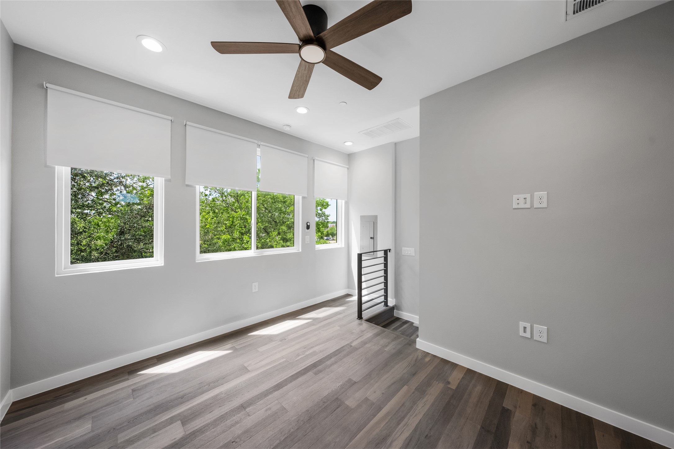 2108 Tillery Street, Unit 16 Austin, TX 78723 - Photo 11 of 15 Spacious room featuring wood-finish flooring, recessed lighting, and a ceiling fan