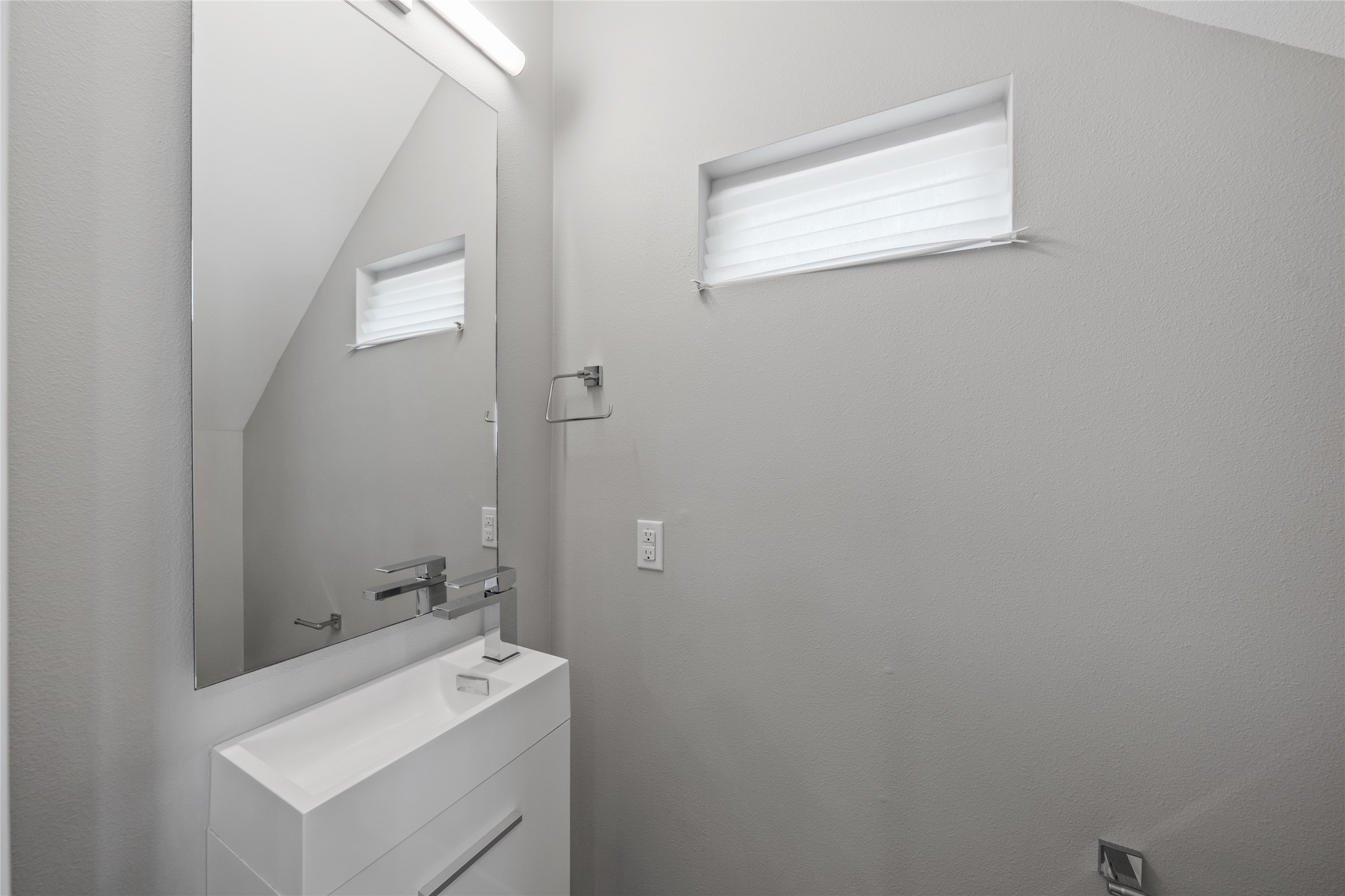 2108 Tillery Street, Unit 16 Austin, TX 78723 - Photo 8 of 15 Modern vanity with integrated rectangular sink and polished chrome faucet