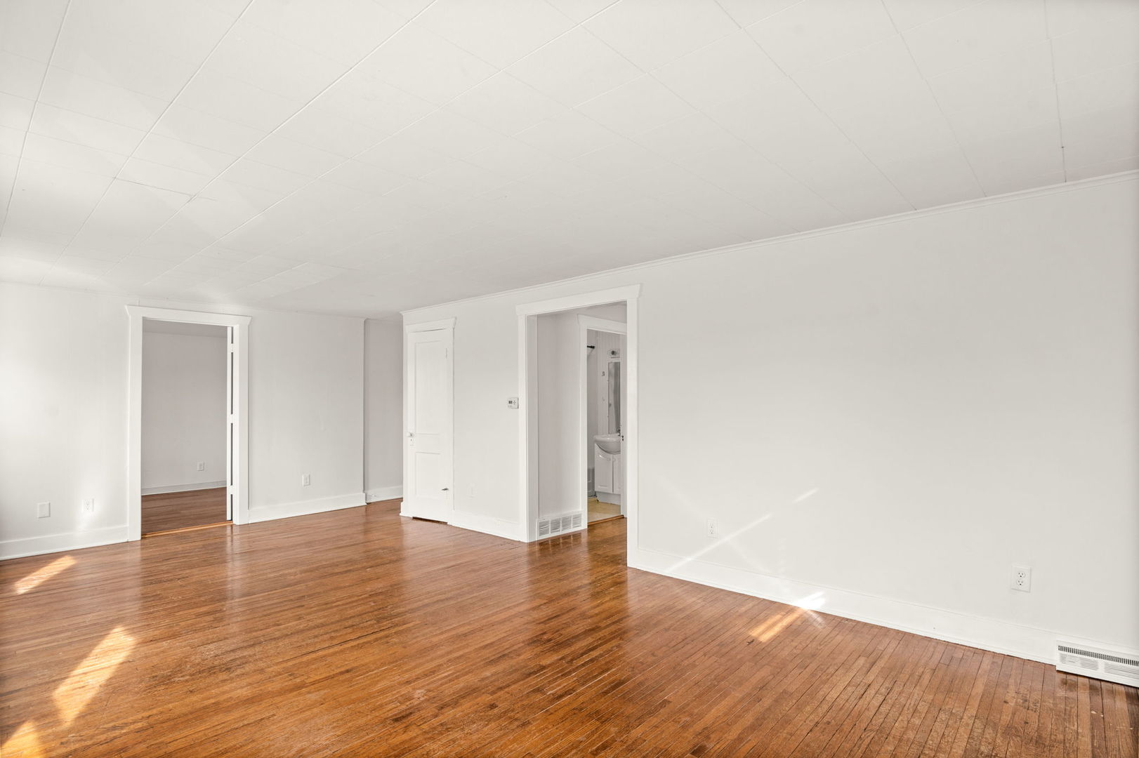 827 East Wilson Street, Unit B Batavia, IL 60510 - Photo 7 of 17 a view of an empty room with wooden floor