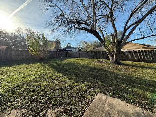 a backyard of a house with lots of green space