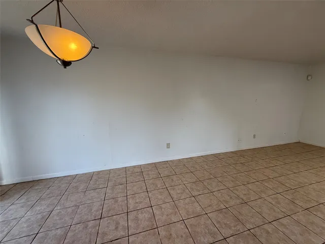 a view of a room and chandelier
