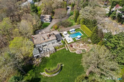 an aerial view of a residential houses with outdoor space