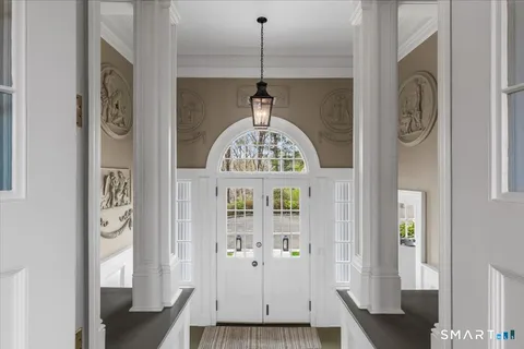 a view of entryway with wooden floor