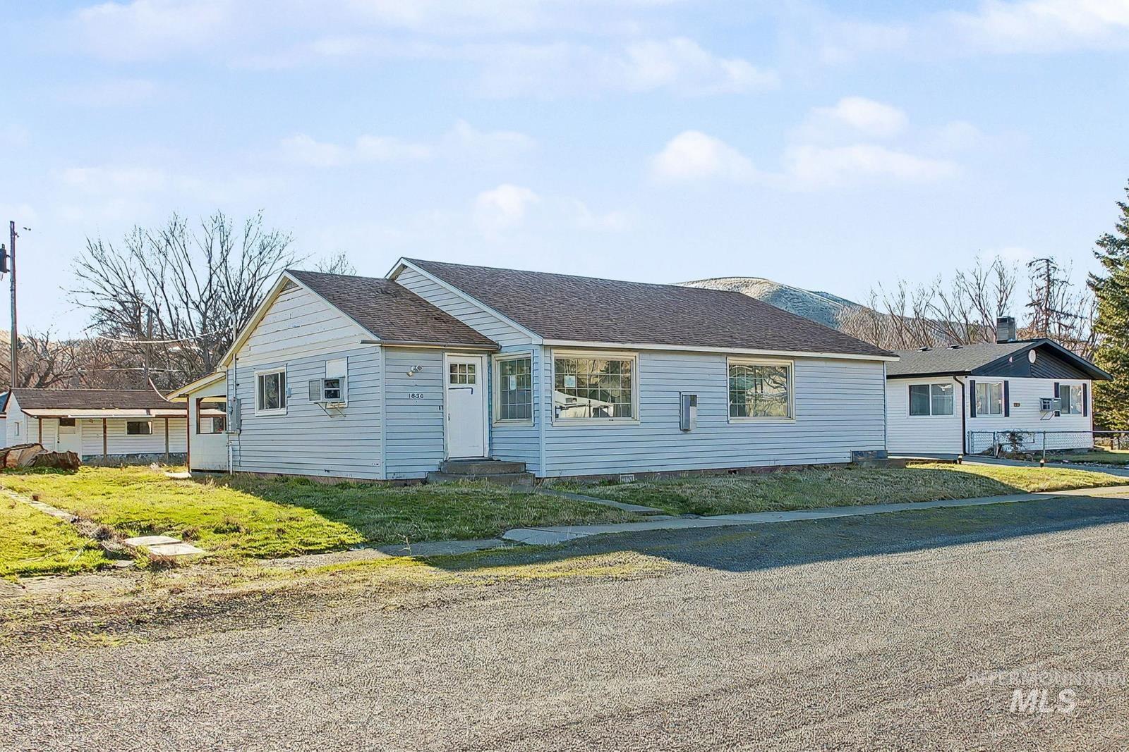 1830 Columbia Street Pomeroy, WA 99347 - Photo 1 of 28 Ranch-style home with roof with shingles, entry steps, and crawl space
