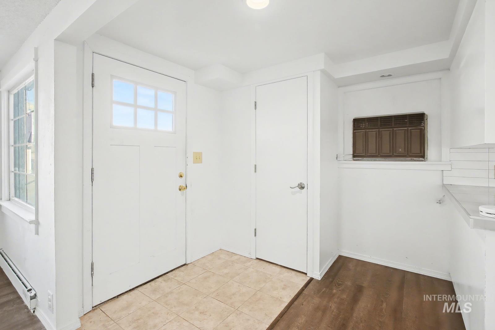 1830 Columbia Street Pomeroy, WA 99347 - Photo 3 of 28 Entrance foyer with baseboard heating and tile patterned floors