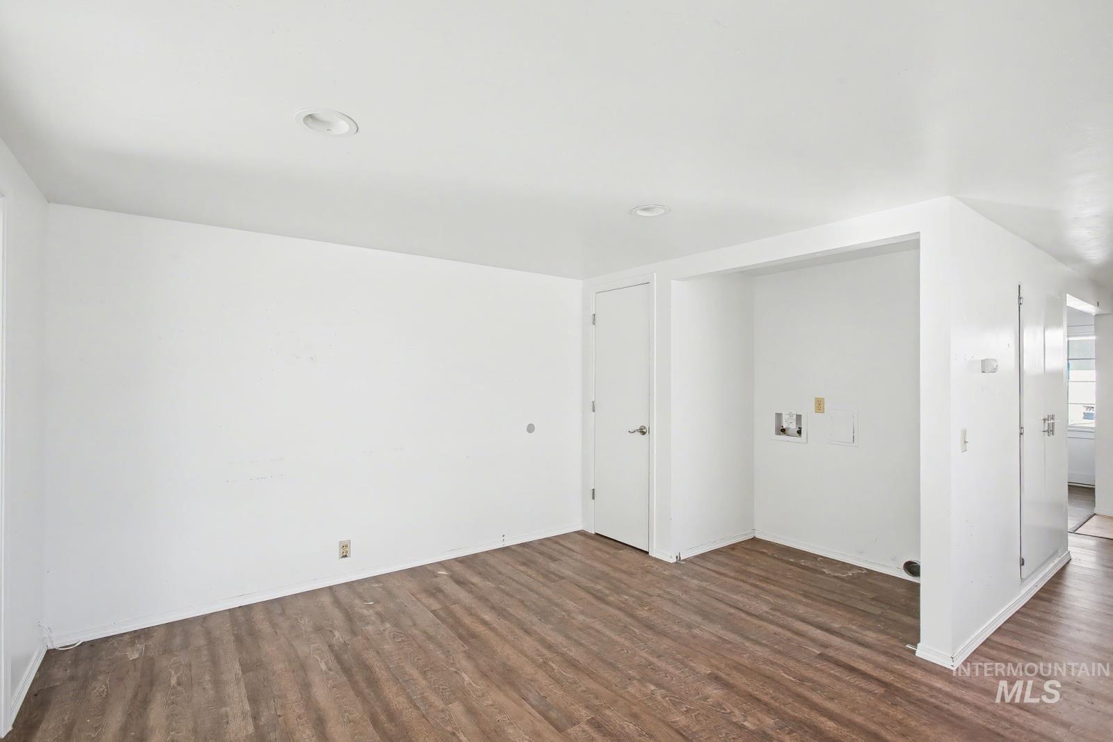 1830 Columbia Street Pomeroy, WA 99347 - Photo 9 of 28 Empty room featuring dark wood finished floors