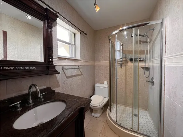 a view of hallway with wooden floor