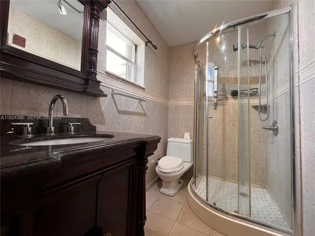 a view of a room with wooden walls