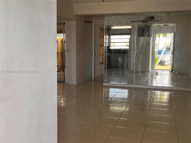 a bathroom with a glass shower door
