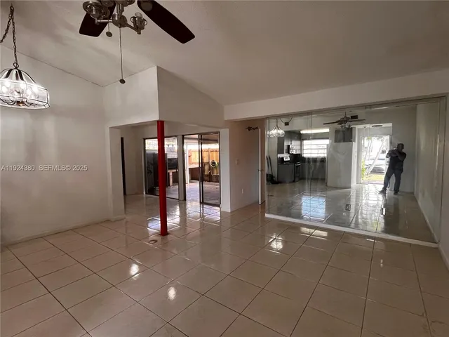 a kitchen with stainless steel appliances granite countertop a refrigerator a stove a sink and dishwasher