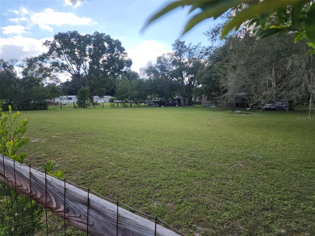 0 Northwest 20th Street Ocala, FL 34482 - Photo 2 of 9 a view of a field with wooden fence