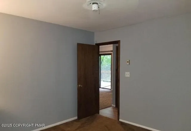 a view of hallway with a small space