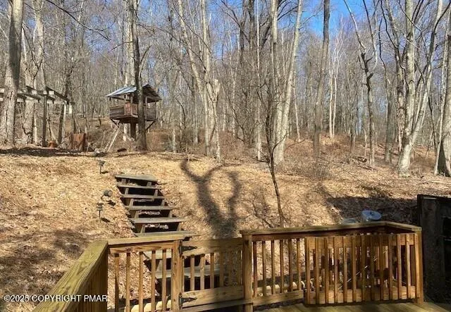a view of a balcony with wooden floor