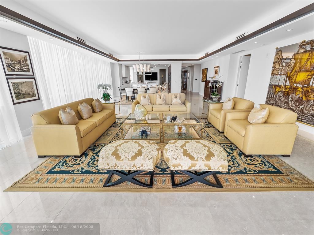 353 Sunset Drive, Unit 401 Fort Lauderdale, FL 33301 - Photo 12 of 43 a living room with furniture and wooden floor