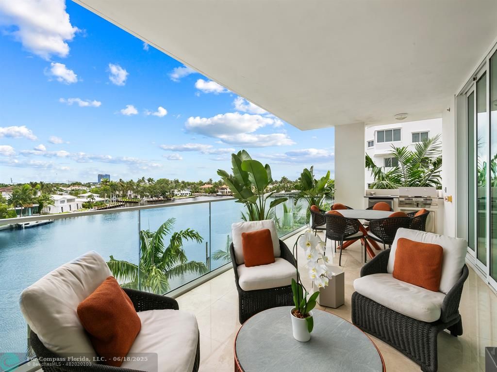 353 Sunset Drive, Unit 401 Fort Lauderdale, FL 33301 - Photo 14 of 43 a view of a patio with couches chairs and potted plants
