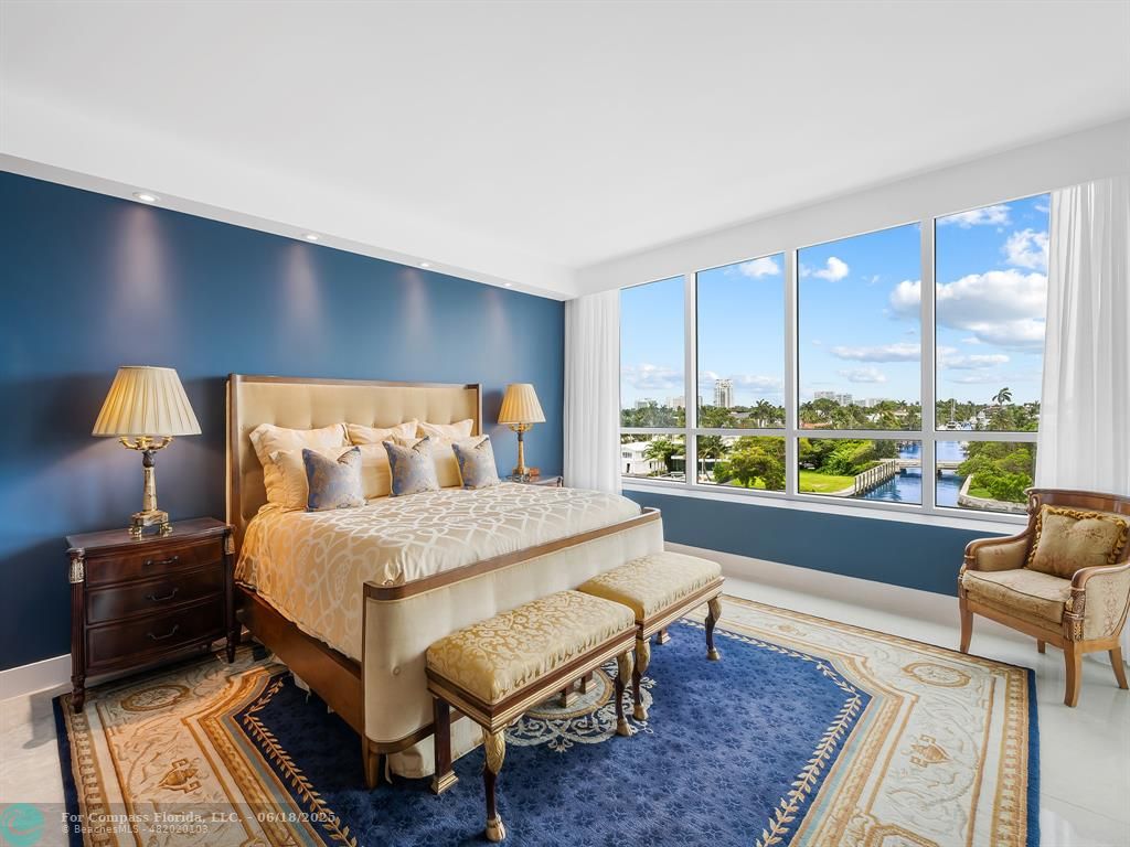 353 Sunset Drive, Unit 401 Fort Lauderdale, FL 33301 - Photo 22 of 43 a bedroom with a bed and a night stand