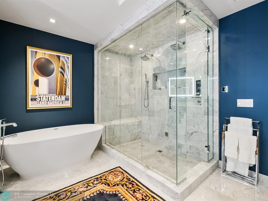 353 Sunset Drive, Unit 401 Fort Lauderdale, FL 33301 - Photo 26 of 43 a bathroom with a bathtub and a shower