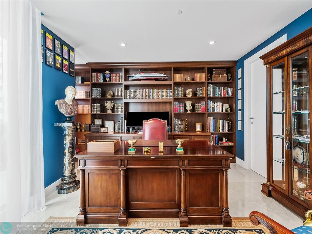 353 Sunset Drive, Unit 401 Fort Lauderdale, FL 33301 - Photo 34 of 43 a living room with furniture a piano and a bookshelf