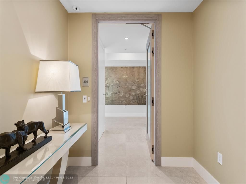 353 Sunset Drive, Unit 401 Fort Lauderdale, FL 33301 - Photo 7 of 43 a bathroom with a light fixture and a sink