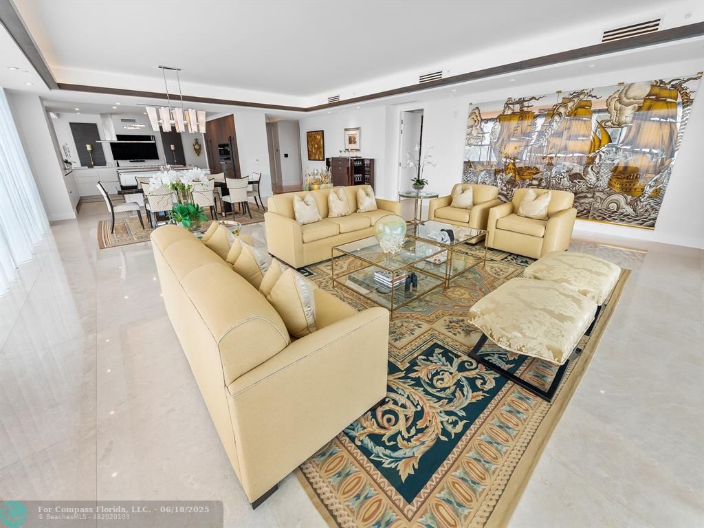 353 Sunset Drive, Unit 401 Fort Lauderdale, FL 33301 - Photo 10 of 43 a living room with furniture and a flat screen tv