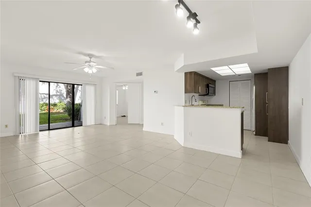 a kitchen with a sink stove and refrigerator